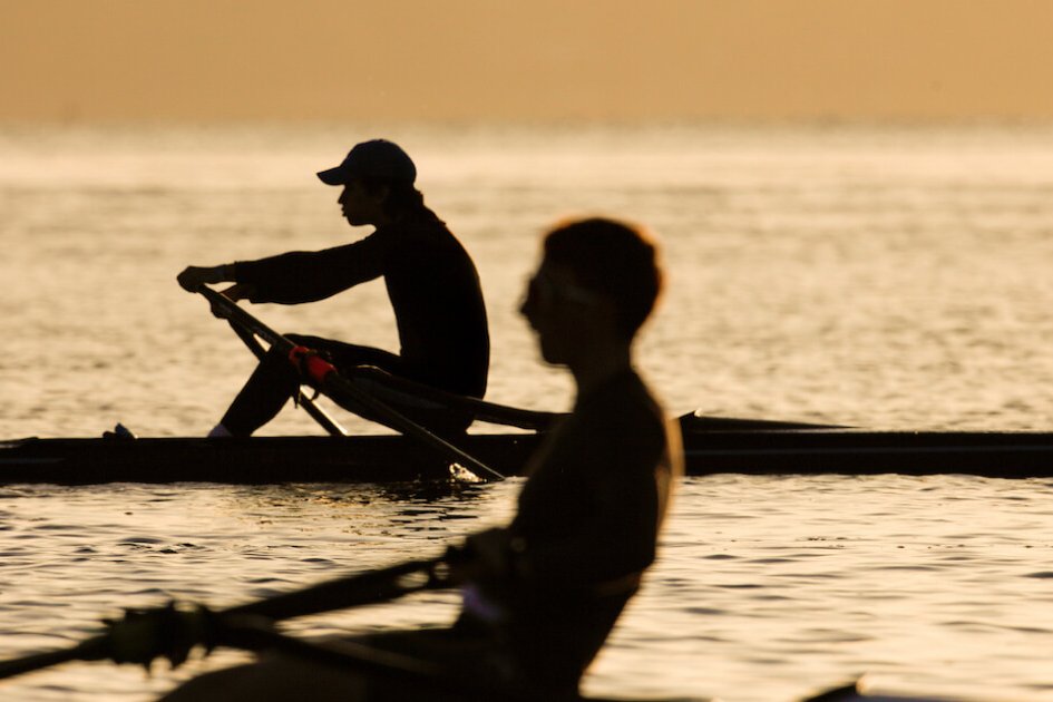 Sparks youth rowing camp athletes on the water at golden hour