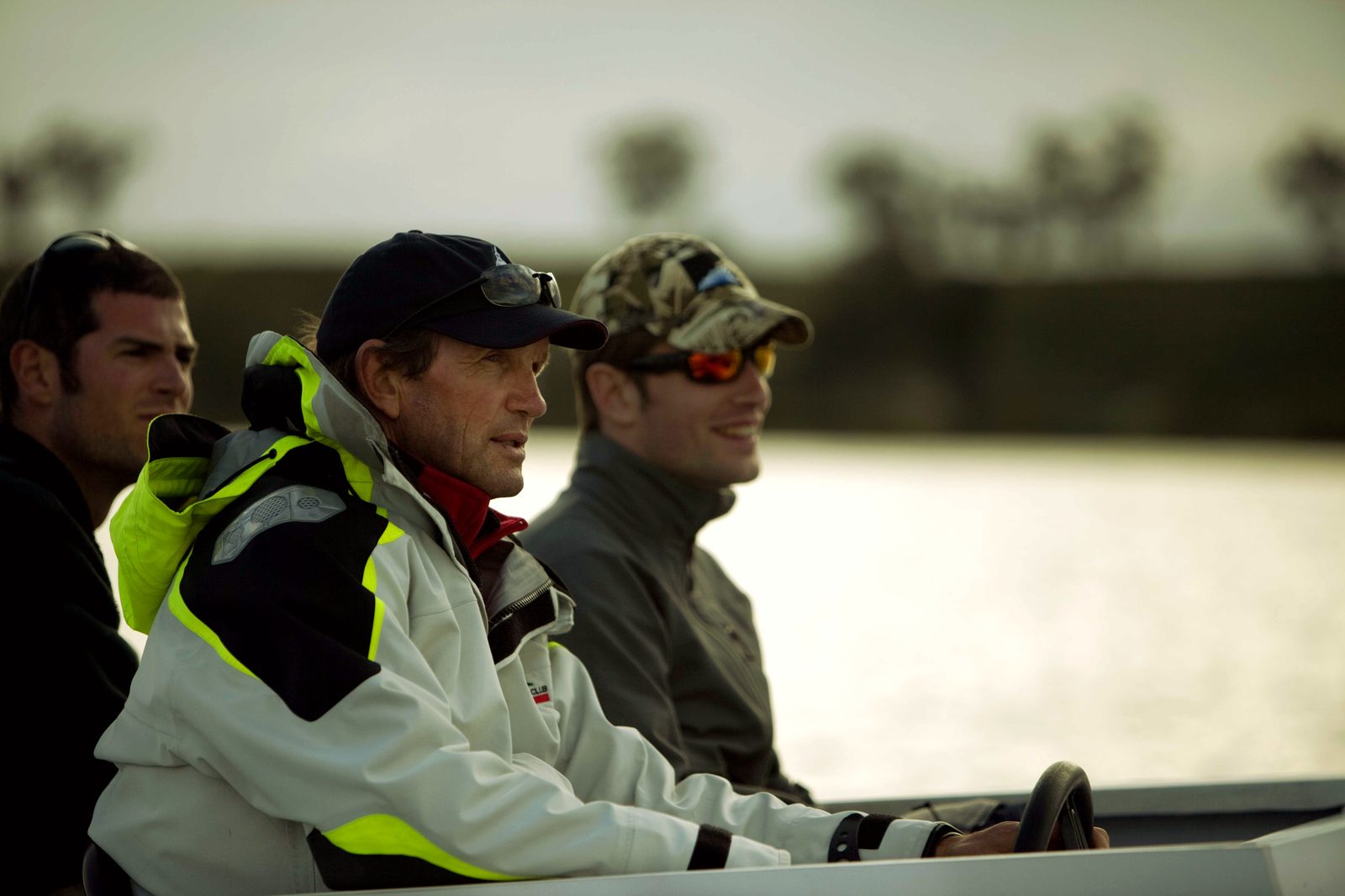 Tim McLaren in a coaching launch on the water