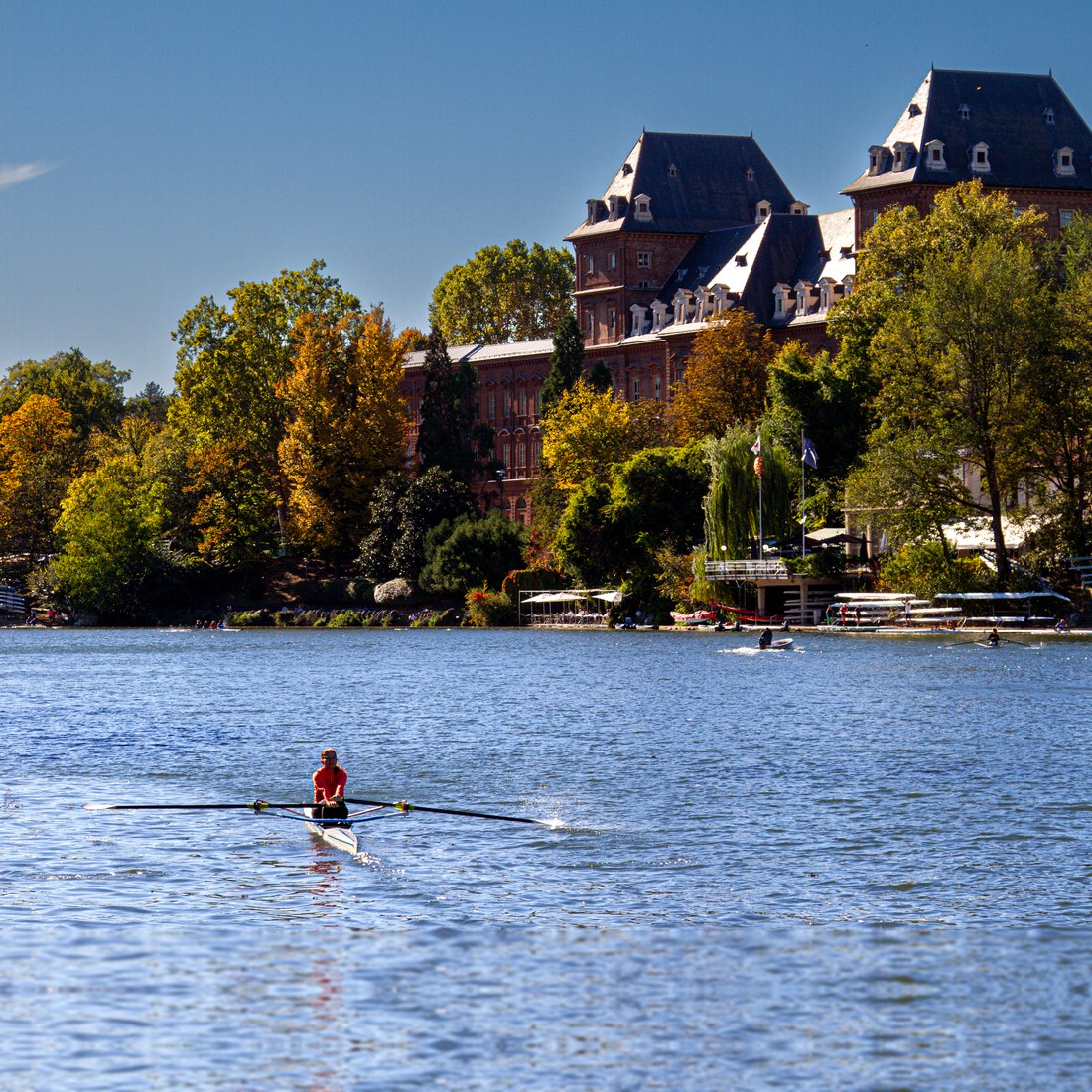 A single sculler on the Po River in Turin